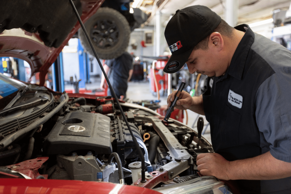 ASE-certified auto mechanics in Merriam, KS, at Done With Care Auto Repair. Image of a technician performing a detailed engine inspection and diagnostic testing to identify performance issues, prevent breakdowns, and ensure reliable vehicle operation and long-term engine health.