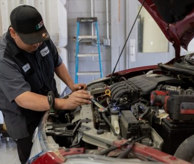 Merriam Drivers Trusted Auto Repair, Auto Repair Service in Merriam KS At Done With Care Auto Repair. Mechanic inspecting a car engine in auto repair shop.