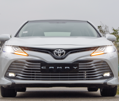 Fall Toyota Camry Brake Inspection in Merriam, KS | Done With Care Auto Repair. Image of the front of a silver toyota camry with black license plate